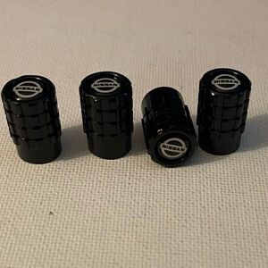 Nissan Logo Valve Stem caps in Black set of 4 NWT
